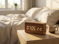 Wooden LED digital alarm clock on a bedside table at sunrise with a coffee cup, weekday alarm, feature image 2